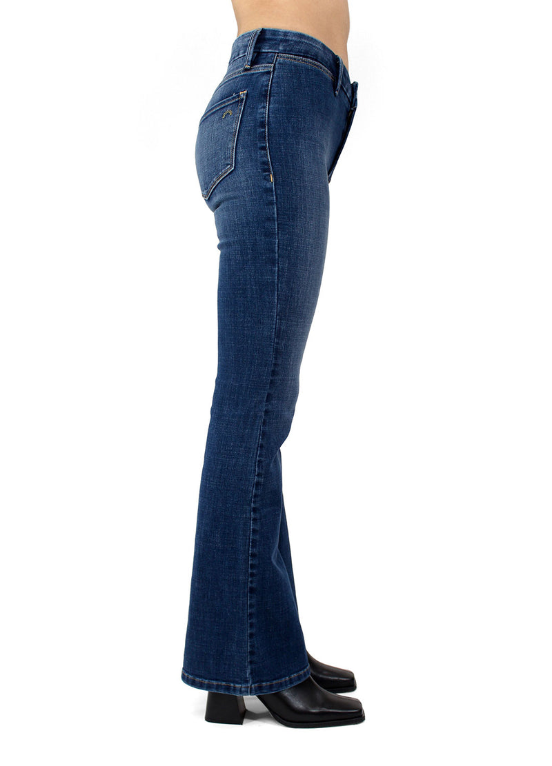 Side view of the Porter Blue Apparel Delilah Mid Rise Sustainable Denim Bootcut in Abbie Wash