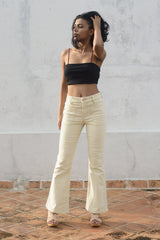 Model wearing Wanderer Flare Corduroy Jeans in Cream by Porter Blue Apparel - Ethically made jeans